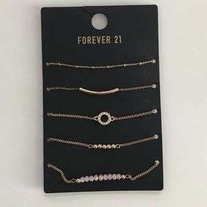 Gold and pink bracelets (5 piece)